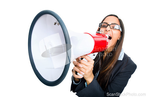 Image of Empty vessels make the most noise. a young businesswoman shouting into a megaphone against a studio background.