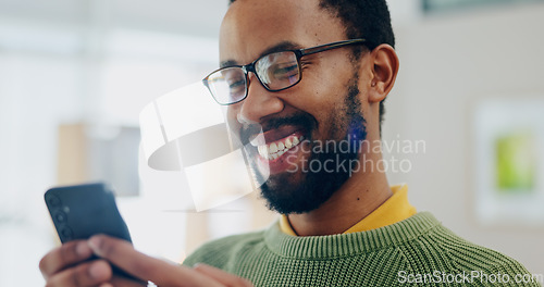 Image of Happy, black man and phone with text and smile from social media scroll and internet in a home. Mobile networking, male person and happy with app and blog search for online shopping and message