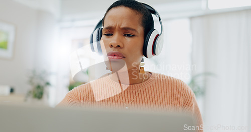 Image of Woman, headphones and frustrated with laptop for remote work from home for confused thinking, error and mistake. African freelancer girl, computer and listen with fail, 404 glitch and stress in house