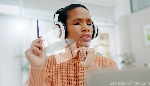 Image of Remote work, black woman and speaking on a laptop for business, online planning or communication. House, strategy and an African freelance worker with conversation, headphones and talking on a pc