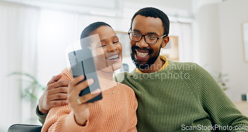 Image of Happy, selfie and black couple on sofa online for social media, internet and profile picture. Love, dating and man and woman take photo for bonding, relationship and relax together in living room