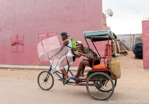 Image of Traditional rickshaw on the city streets. Rickshaws are a common mode of transport in Madagascar.