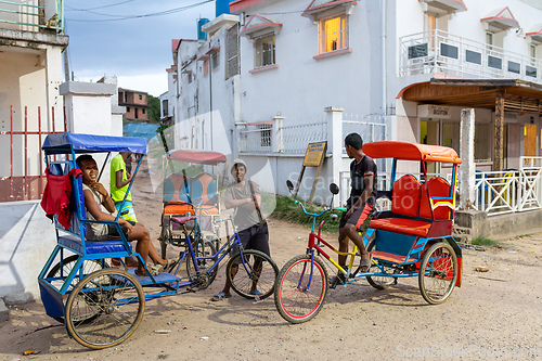 Image of Traditional rickshaw on the city streets. Rickshaws are a common mode of transport in Madagascar.