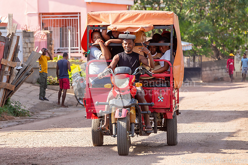 Image of Rarely seen motor rickshaw on the city streets. Rickshaws are a common mode of transport in Madagascar.