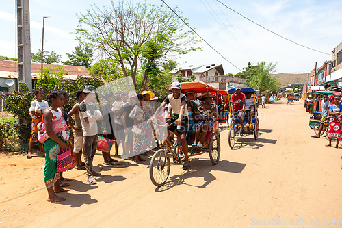 Image of Traditional rickshaw on the city streets. Rickshaws are a common mode of transport in Madagascar.