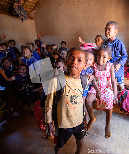 Image of Happy Malagasy school children students in classroom. School attendance is compulsory, but many children do not go to school.