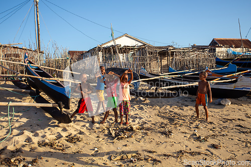 Image of Group of Malagasy children frolicking on the beach near the fishing village of Anakao.