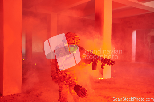 Image of A group of professional soldiers bravely executes a dangerous rescue mission, surrounded by fire in a perilous building.