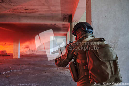 Image of A group of professional soldiers bravely executes a dangerous rescue mission, surrounded by fire in a perilous building.