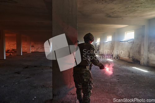 Image of A group of professional soldiers bravely executes a dangerous rescue mission, surrounded by fire in a perilous building.