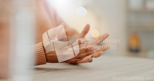 Image of Hands, table and person gesture in conversation in office, communication or chat in creative startup. Closeup, fingers and woman at desk, talk and designer in meeting, negotiation or business speech