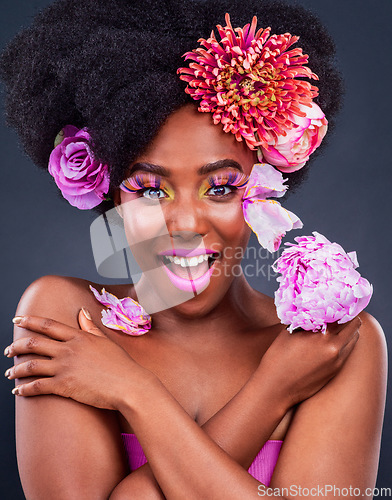 Image of Life may not be perfect but my makeup is. Studio shot of a beautiful young woman posing with flowers in her hair.