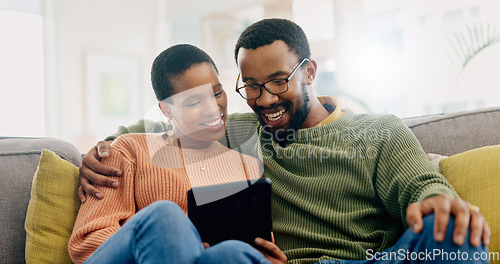 Image of Happy, home tablet and relax black couple reading, smile or watch social media video, blog or relationship news. Happiness, lounge sofa and African man, woman or marriage people check online website