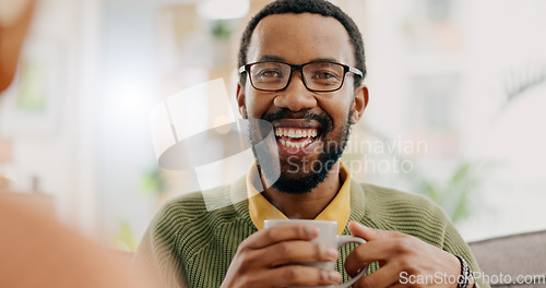 Image of Happy, coffee and a black man in conversation with a woman for love, care or bonding in the morning. Smile, relax and an African person speaking to a person with a drink, laughing or tea in a house