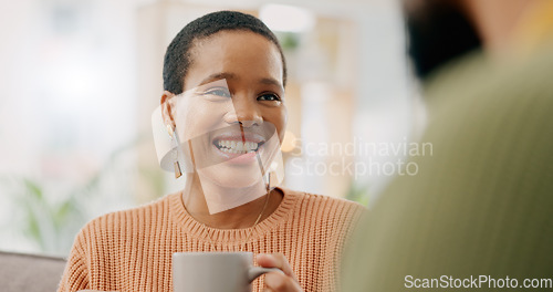 Image of Coffee, discussion and happy woman at home on a living room sofa with a man and hot drink. Couple, tea and smile with communication and conversation together with love and marriage support on a couch