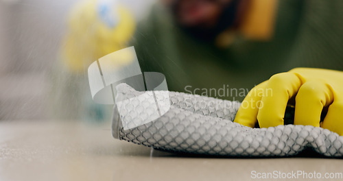Image of Cleaning, cloth on surface and hands with furniture in living room for hygiene, housework and maintenance. Housekeeping, closeup and person with gloves on table for bacteria, dirt and dust in home