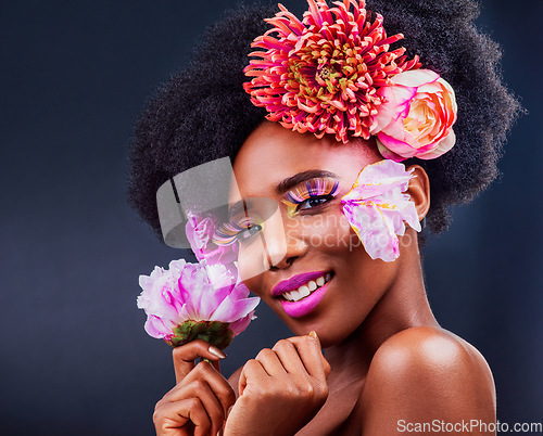 Image of Darling, be daring. Studio shot of a beautiful young woman posing with flowers in her hair.