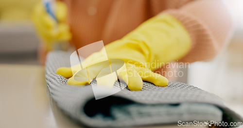 Image of Cleaning, cloth and hands with furniture in living room for hygiene, housework and maintenance in home. Housekeeping, closeup and person with gloves on table for bacteria, dirt and dust on surface