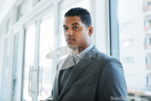 Image of Know what this suit is made of Management material. Portrait of a confident young businessman working in a modern office.