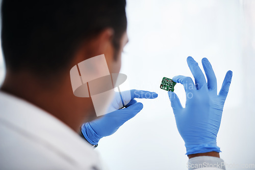 Image of He knows computer hardware like the back of his hand. a young man repairing computer hardware in a laboratory.