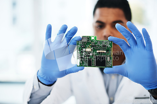 Image of Tech support to the rescue. a young man repairing computer hardware in a laboratory.