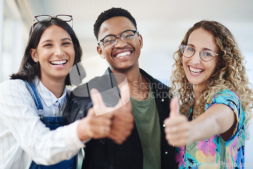 Image of We totally support you. Portrait of a group of businesspeople showing thumbs up in an office.