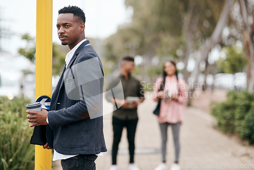 Image of Stay ready for the day opportunity crosses your path. a young businessman about to cross a city street.