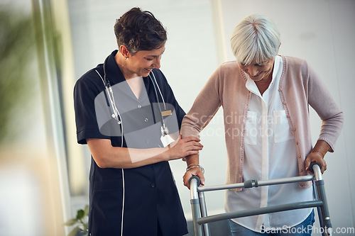 Image of Youve walked so far already. a young female nurse assisting a senior woman walk using a walker in a nursing home.