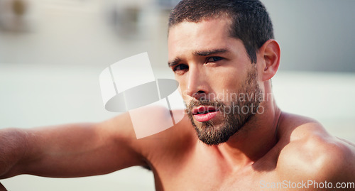 Image of Quitting does not exist in my vocabulary. Cropped portrait of a handsome shirtless young sportsman taking a break after a workout outdoors.