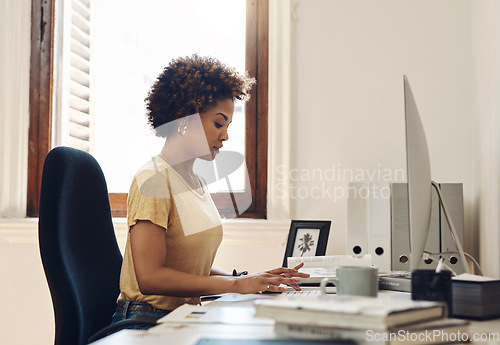 Image of Nurturing the growth of her startup. a young businesswoman working on a computer in an office.