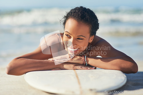 Image of This is exactly what I needed. a young woman out at the beach with her surfboard.