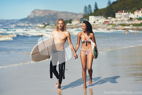 Image of Shes someone I can be myself with. a young couple spending the day at the beach with their surfboards.