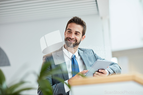 Image of Technology allows me to translate my ideas even further. a young businessman using a digital tablet in an office.