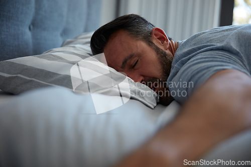 Image of The best stage of the day. an attractive mature man fast asleep on his bed at home.