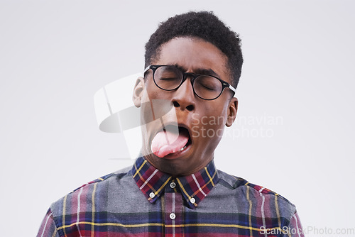 Image of Nah I dont like it. Studio shot of a young man making a funny face against a gray background.