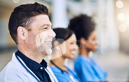 Image of Were focused on getting you better. Defocused shot of a group of medical practitioners standing together.