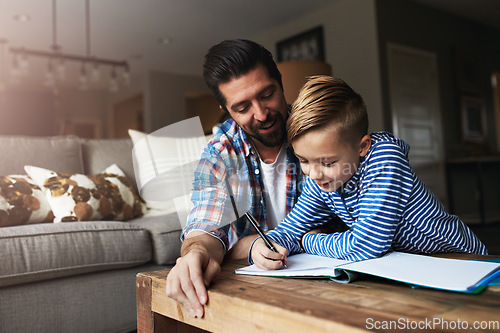 Image of Parents play an active role in a childs educational upbringing. a father helping his little son with his homework.