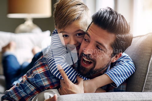 Image of Big hugs for the bestest Dad. a father and his little son bonding together at home.