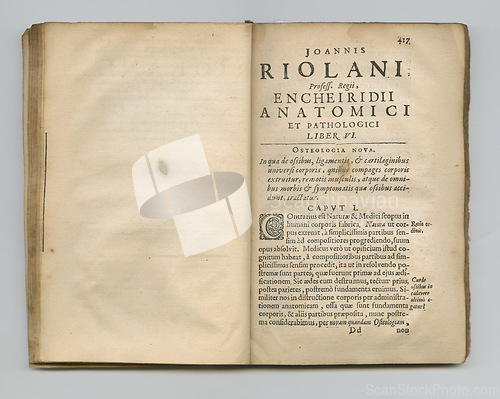 Image of Weathered old Latin pages. An old medical book with its pages on display.