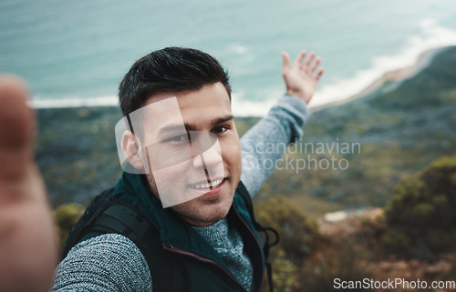 Image of You cant be bored in a world as beautiful as this. a young man taking selfies while out on a hike.