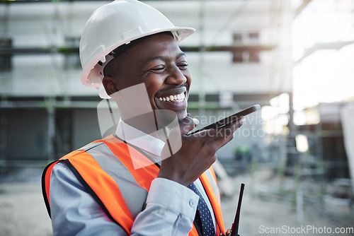 Image of If anything keeps a client happy it’s availability. a young man using a smartphone while working at a construction site.