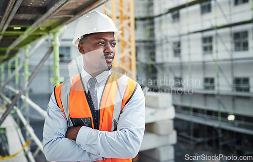 Image of Quality levels thats as high as their buildings. a confident young man working at a construction site.