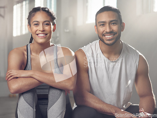 Image of Theres something for everyone at the gym. two young athletes sitting together at the gym.