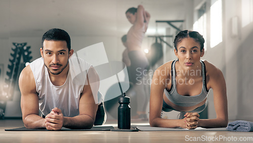 Image of Skipping gym is not even a option. two young athletes working out together at the gym.