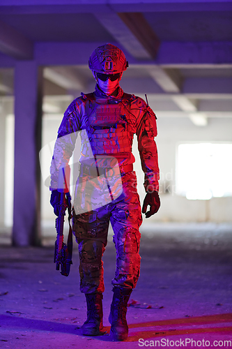 Image of A professional soldier undertakes a perilous mission in an abandoned building illuminated by neon blue and purple lights