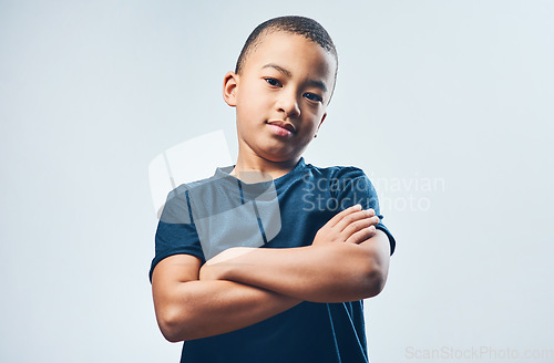 Image of Im the coolest kid youll ever meet. Studio shot of a cute little boy posing confidently against a grey background.