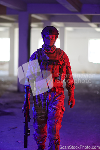 Image of A professional soldier undertakes a perilous mission in an abandoned building illuminated by neon blue and purple lights