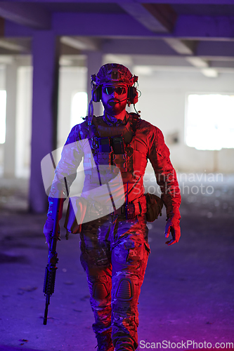 Image of A professional soldier undertakes a perilous mission in an abandoned building illuminated by neon blue and purple lights