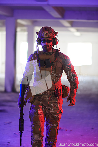 Image of A professional soldier undertakes a perilous mission in an abandoned building illuminated by neon blue and purple lights