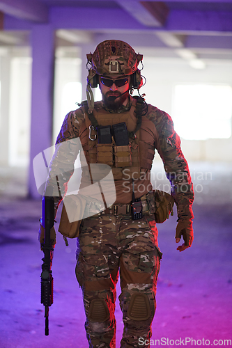 Image of A professional soldier undertakes a perilous mission in an abandoned building illuminated by neon blue and purple lights